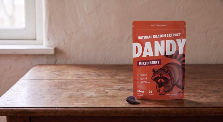 The Dandy pouch and one gummy on a cleared desk
