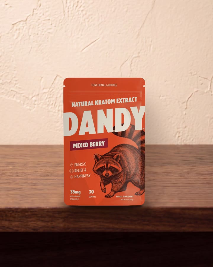 The Dandy Mixed Berry pouch on a wooden shelf