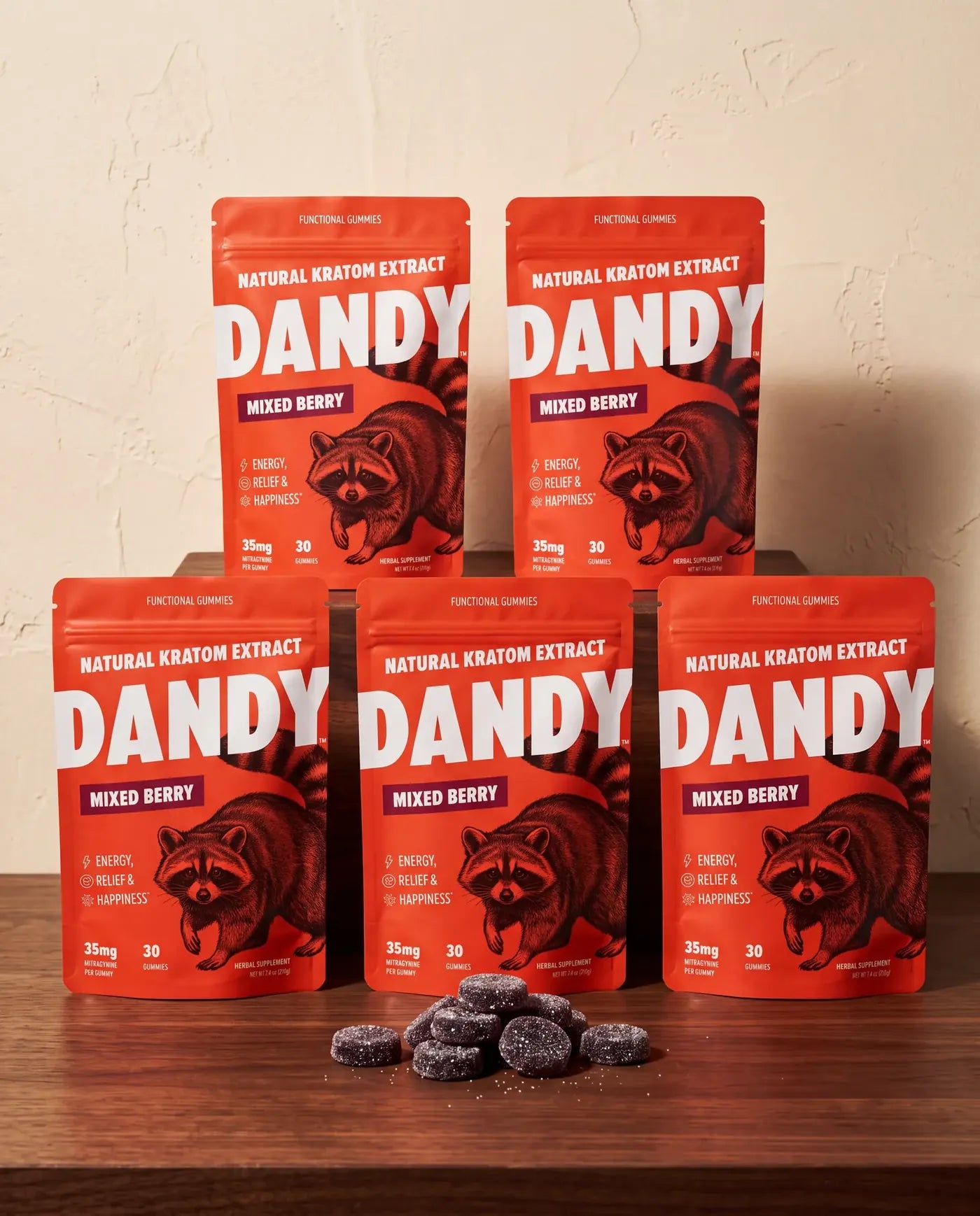 Five Dandy Mixed Berry pouches stocked on a wooden shelf