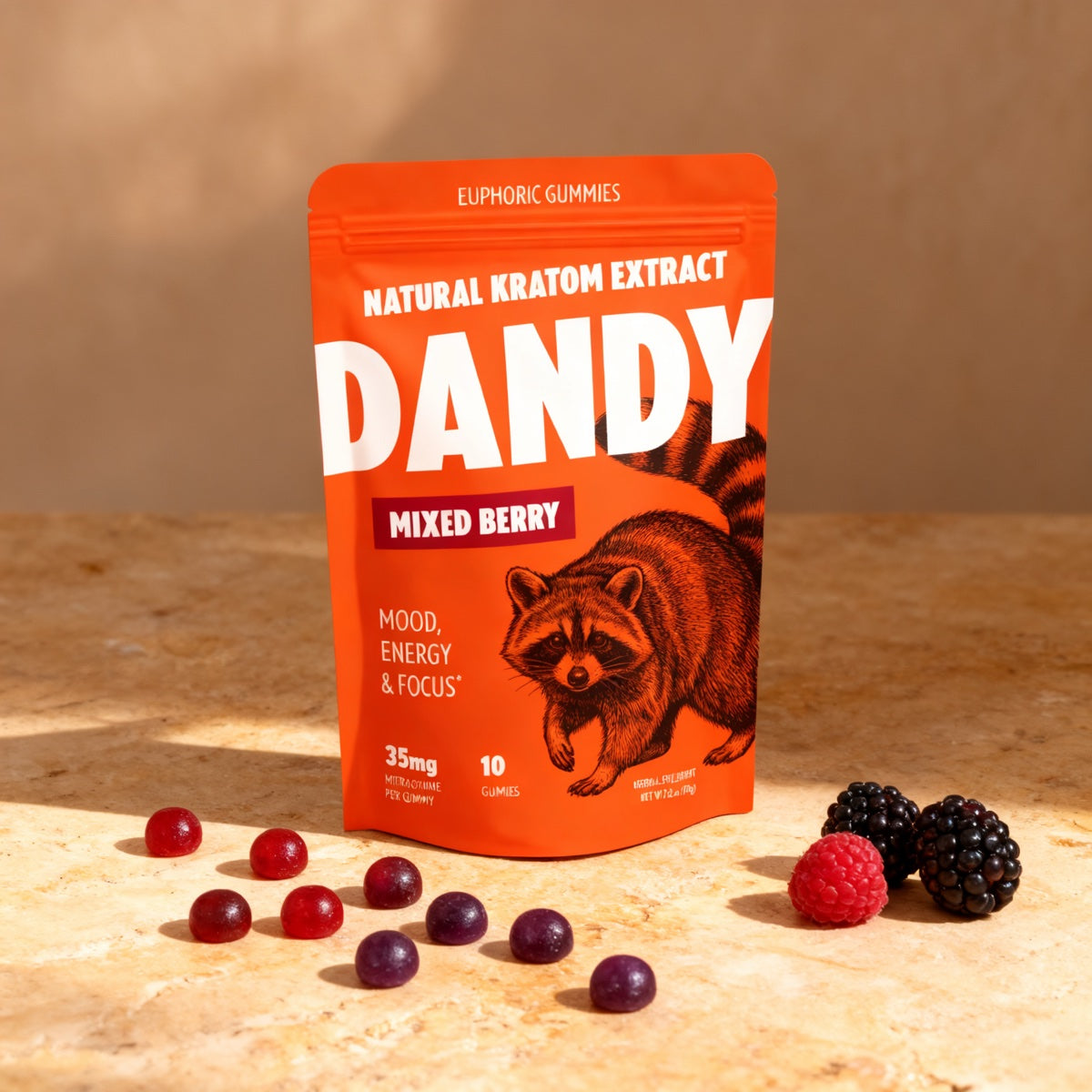 A Dandy Mixed Berry Gummies pouch, label readable, with gummies beside it on a counter
