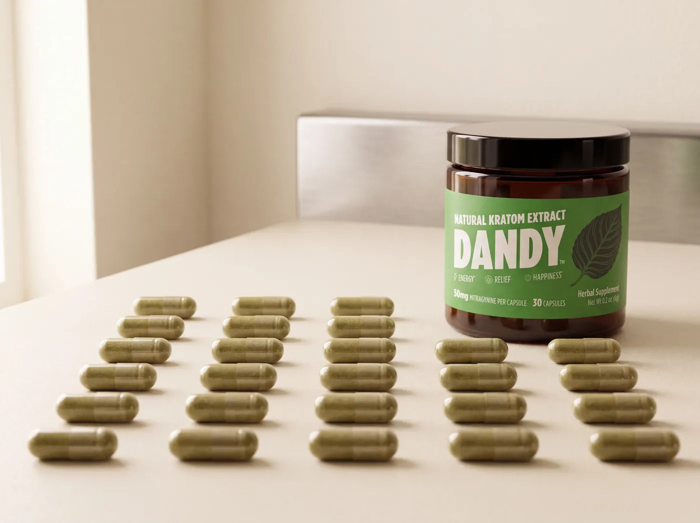 Dandy extract capsules laid in straight rows beside their jar, the label in focus.